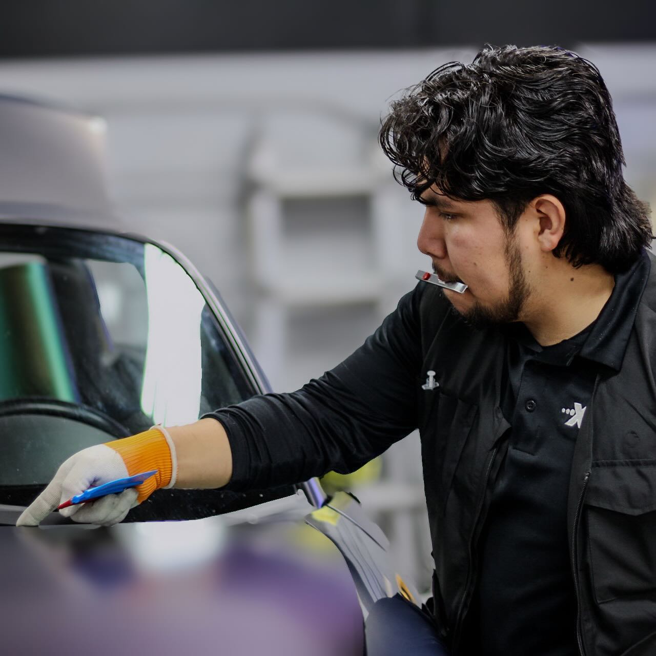 Daniel Rosas (owner ) installing vinyl wrap